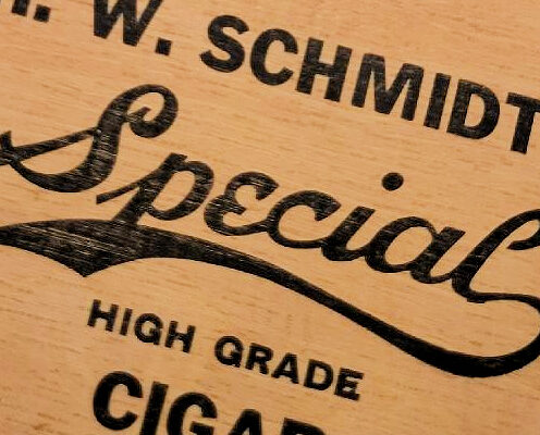Photo Caption: H.W. Schmidt cigar box with circa 1845 cigar cutter and meerschaum cigar holder.