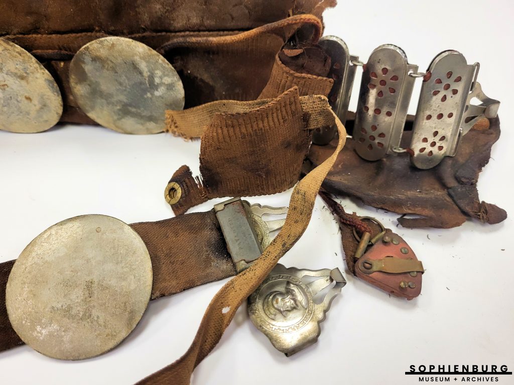 PHOTO CAPTION: Close up of leather belt, battery chain, zinc electrodes, regulator, and belt buckle.